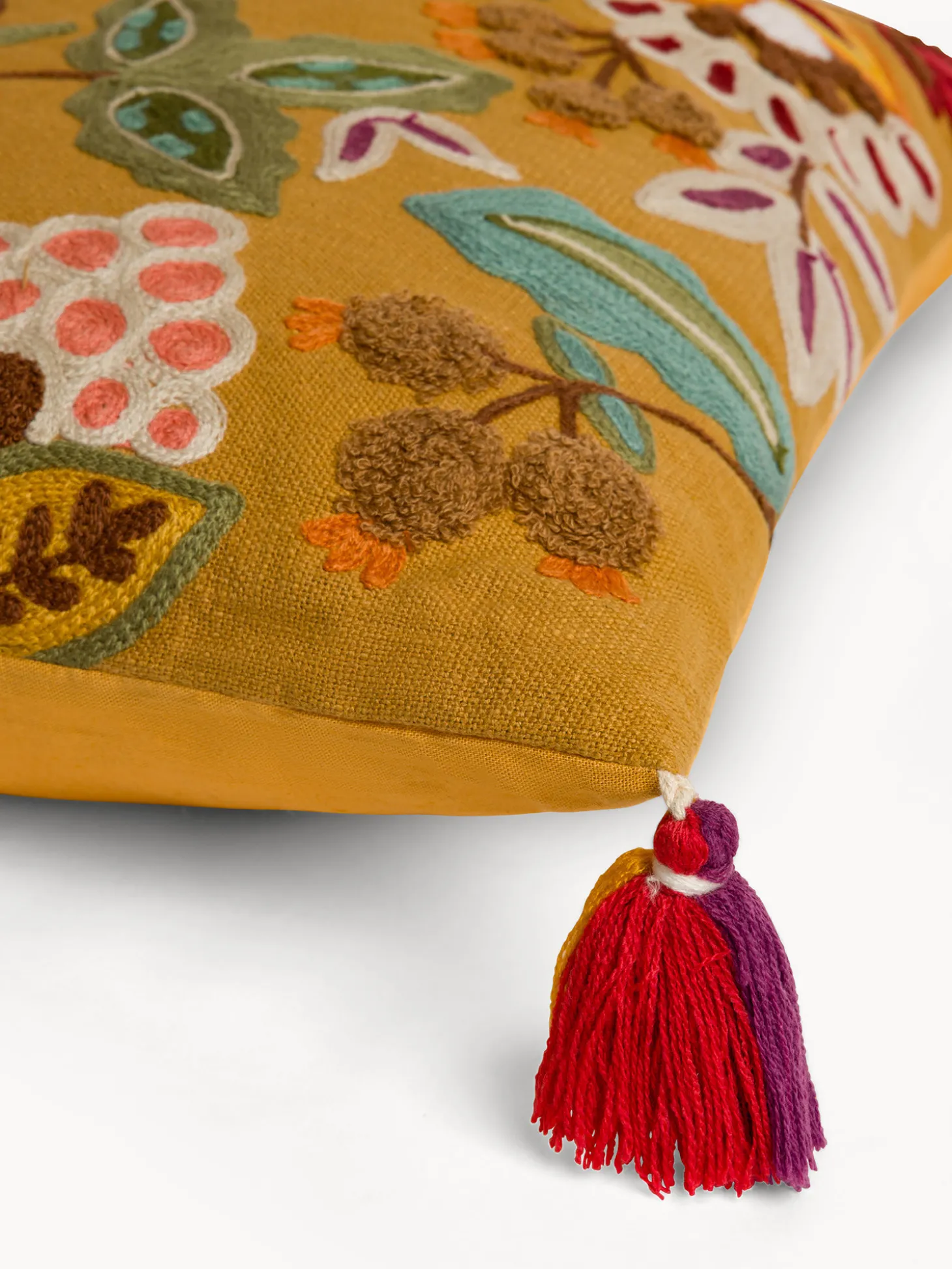 Cuscino 45x45 cm in cotone con ricami e nappe